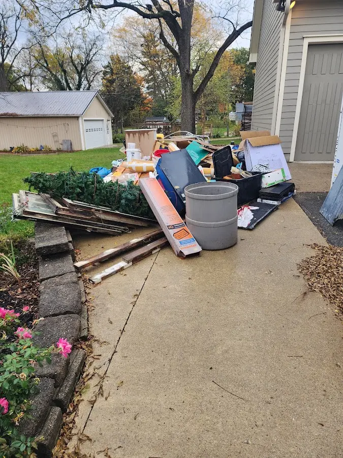 Dumpster being loaded with debris for Roofing Dumpster Rental in Salamanca